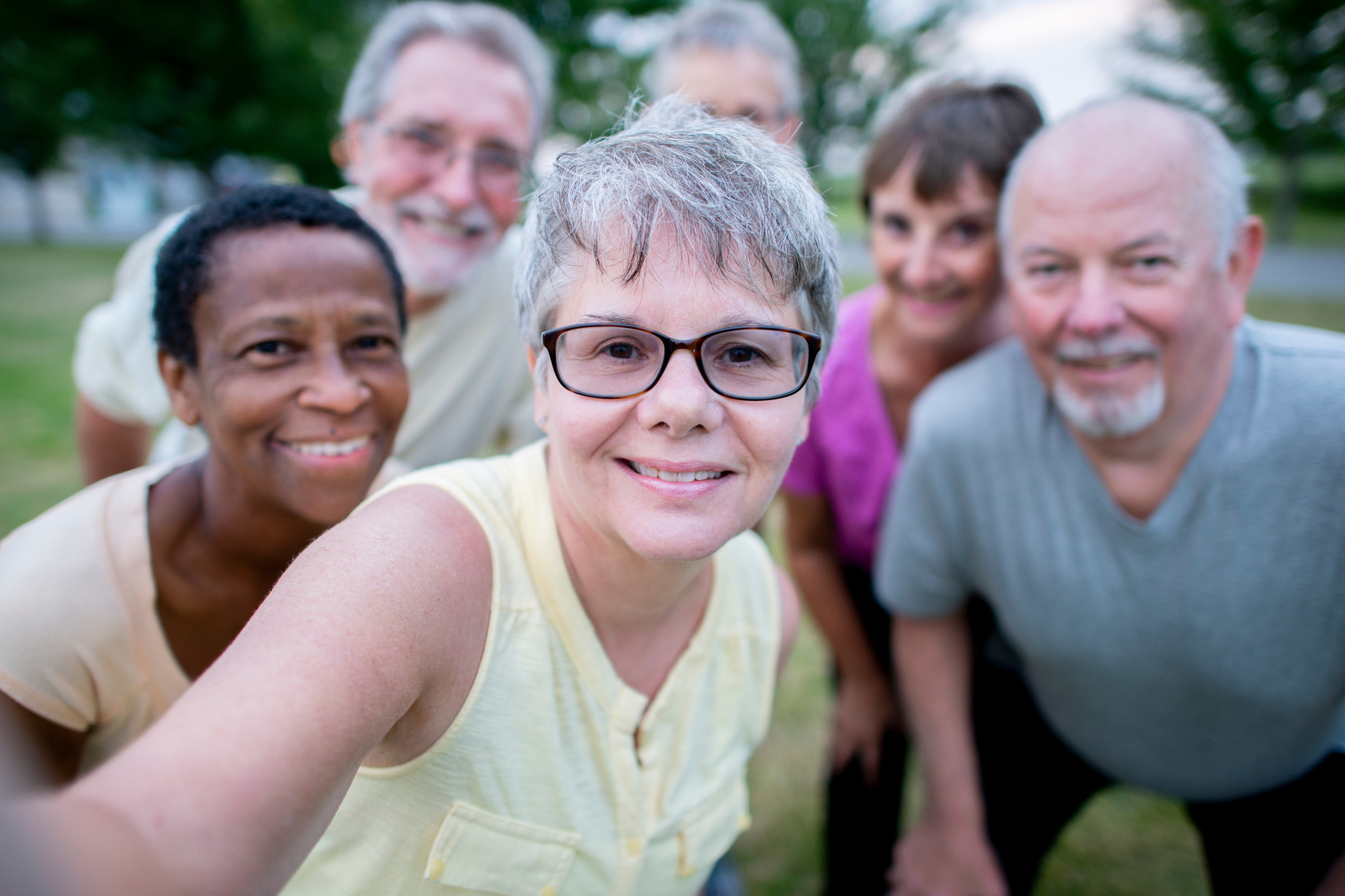 Diverse group of senior citizens exercising together